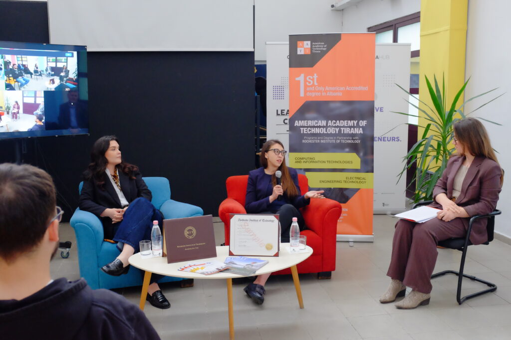 Besarta Hoxha speaking in American Academy of Technology Girls In AI event as Donjeta Sahatçiu and Medina Orana listen.
