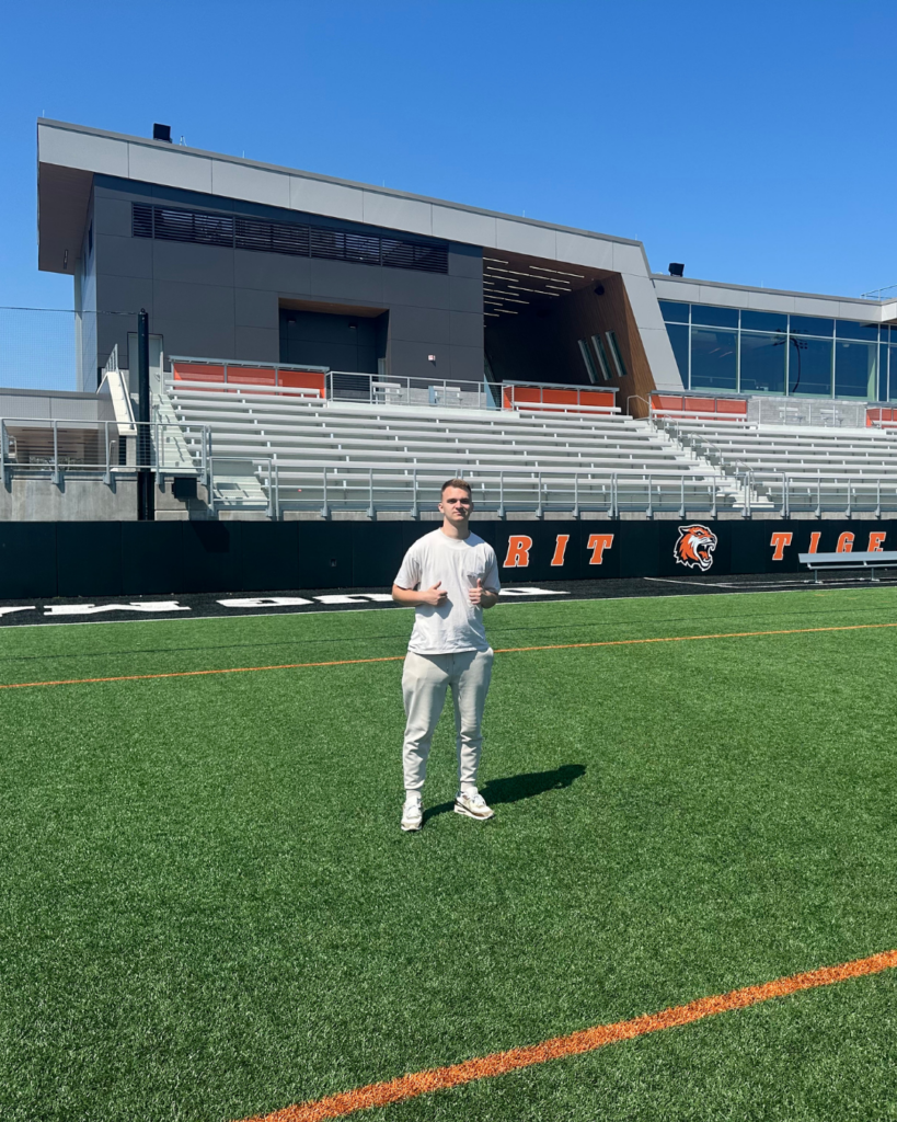 American Academy of Technology university student Klajdi Spahiu in the RIT NY sports field. 
