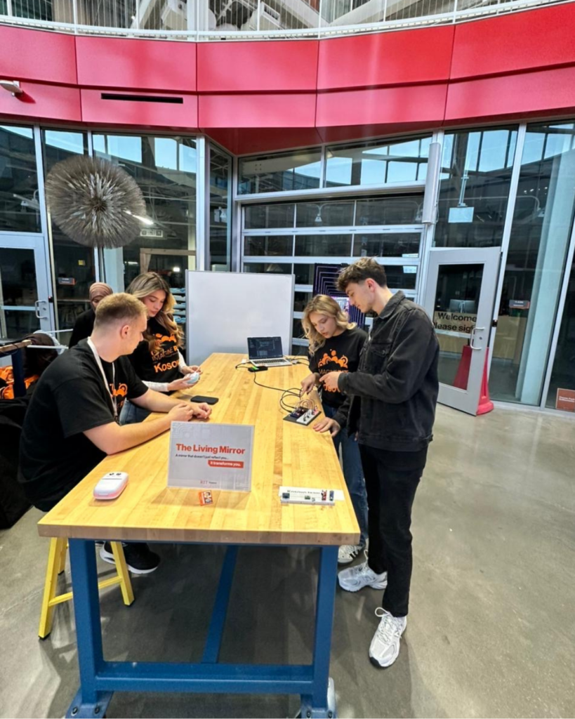 American Academy of Technology university student Klajdi Spahiu participating in Imagine RIT with other students.  