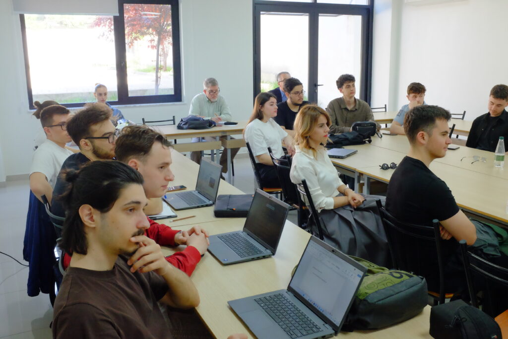 American Academy of Technology Tirana university students and faculty listening to Thomas Durrell Young's lecture.