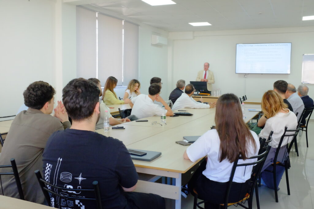American Academy of Technology Tirana university students and faculty listening to Thomas Durrell Young's lecture.