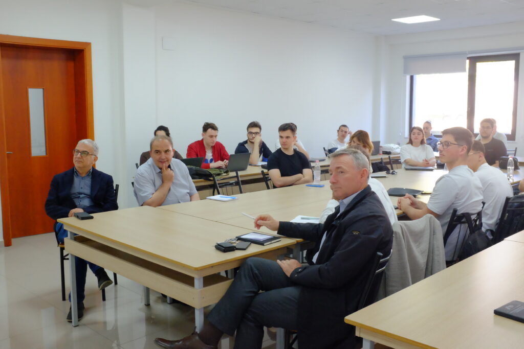 American Academy of Technology Tirana university students and faculty listening to Thomas Durrell Young's lecture. Among the listeners is the university's Rector, Dr. Orion Zavalani. 