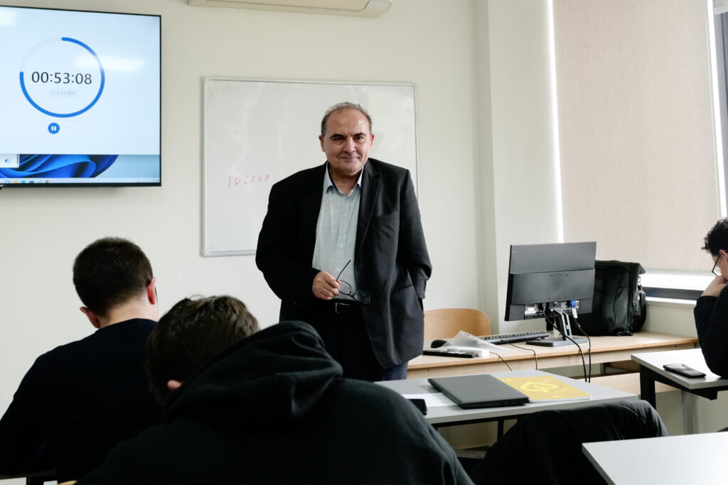Steftcho Dokov teaching mathematics at American Academy of Technology Tirana